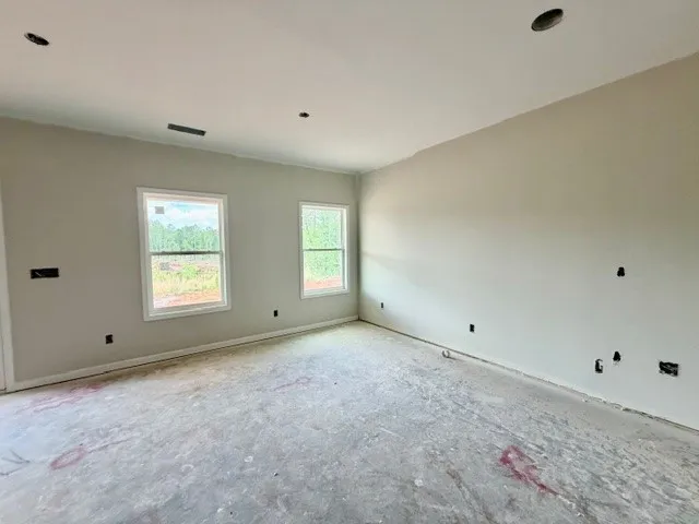 This expansive room, with ample natural light, awaits your personal touch and design vision.