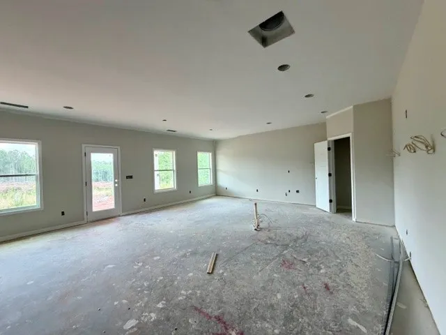 This spacious, unfinished room awaits your personalized design vision.