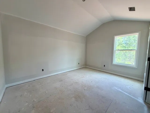 This spacious room awaits your personal touch with ample natural light.