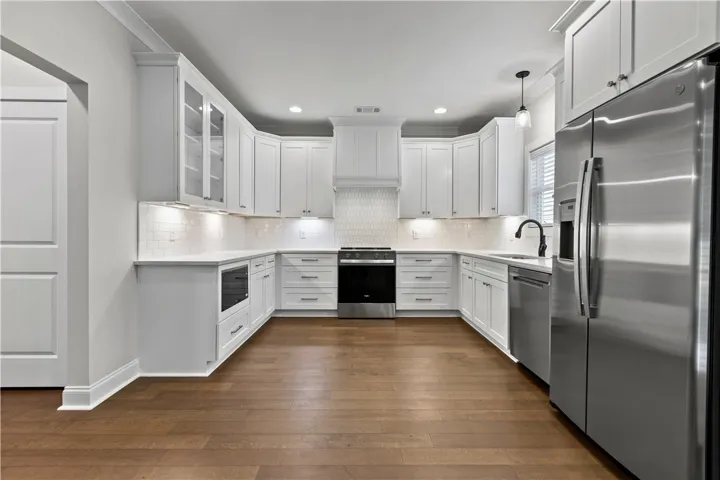 This thoughtfully designed kitchen provides ample counter space and modern appliances.