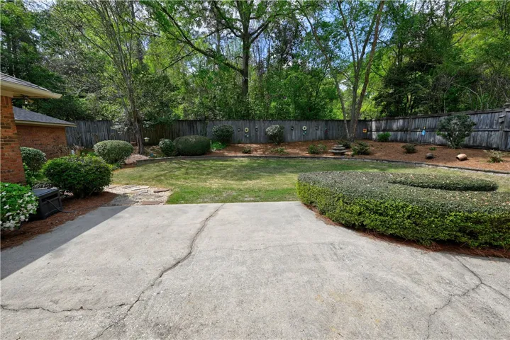 Patio extends to a path to a shed.