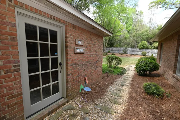 Stone set trail wrapping around the yard.