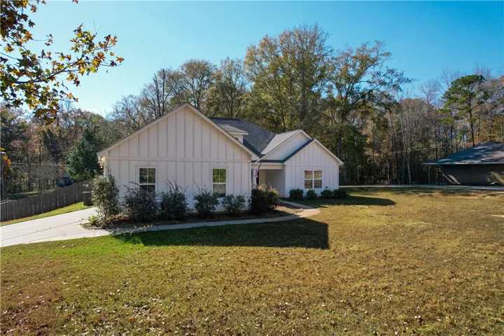 Front Left Elevation - view of Driveway & this home features a 2-car Garage