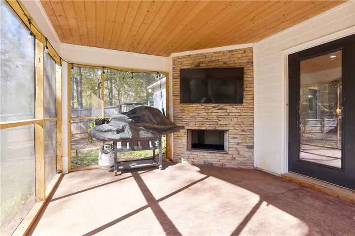 Covered & Screened In Back Porch with Fireplace - just off the Living Area