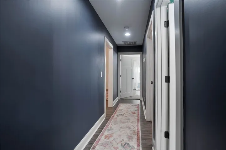 Hall accessing Full Bathroom & all 3 Guest Bedrooms