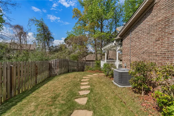 Back yard is so charming and perfect for outdoor activities! Love the flagstone path.