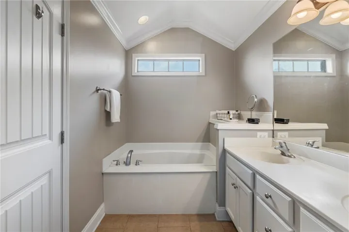 Great lighting in this primary bath because of the windows in the end unit