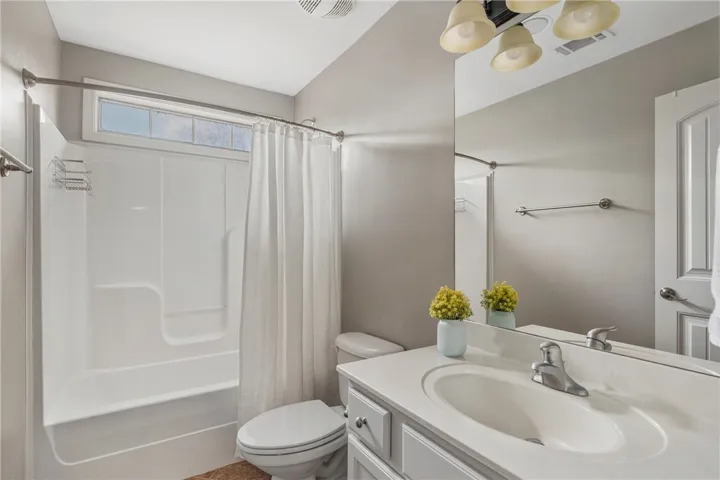 Hall bath serves bedroom 2 and bedroom  3 and has great light bc of the end unit.