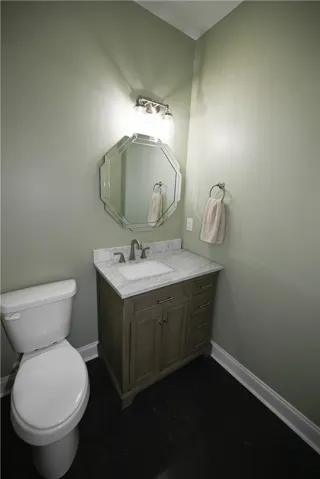 Powder room tucked off of the foyer.