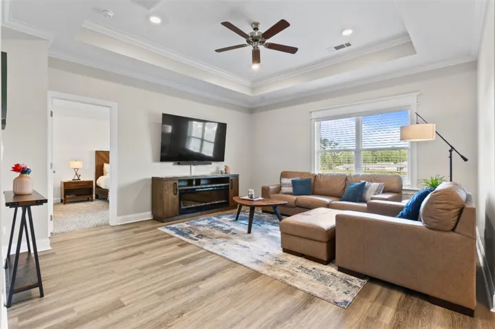 Living room overlooking the backyard with a lake view