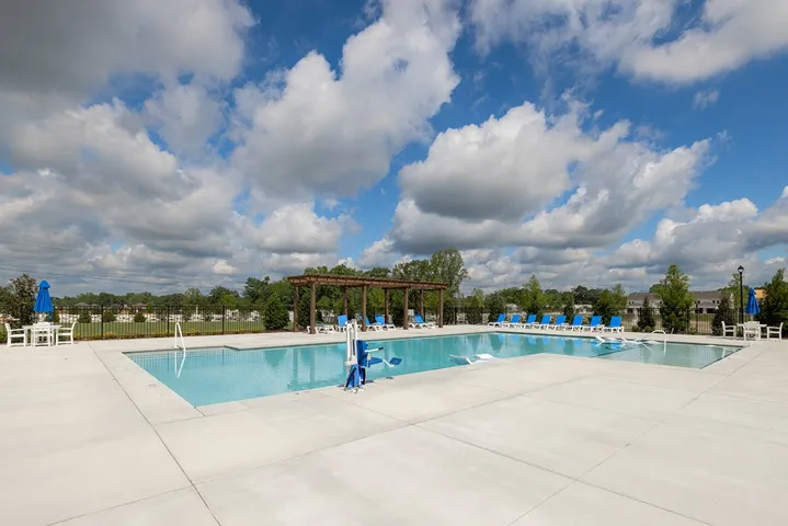 This inviting community pool provides a refreshing escape for leisure and recreation.