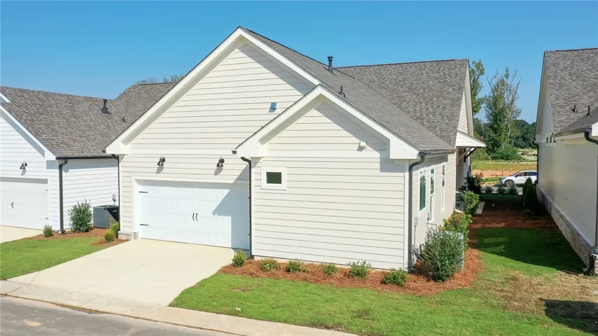 This charming home features a pristine exterior and a convenient  attached garage, ideal for comfortable living.Photos are not of subject property. Photos are of the same floorplan of a completed home.