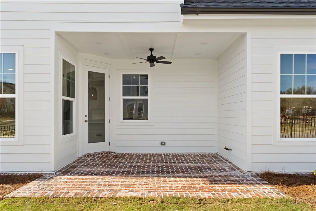 This inviting patio area features a durable brick surface, perfect for outdoor enjoyment. Photos are not of subject property. Photos are of the same floorplan of a completed home.
