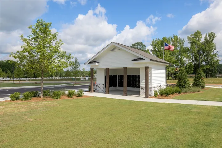 This charming community structure offers convenient mail access with attractive architectural details.