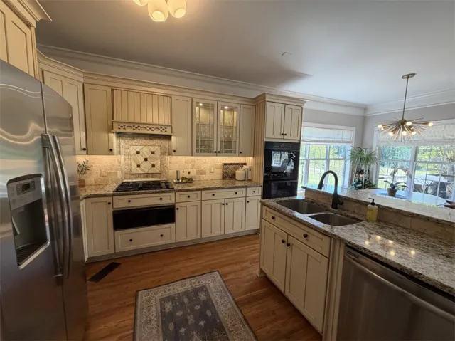 This spacious kitchen offers ample counter space, modern appliances, and abundant natural light.