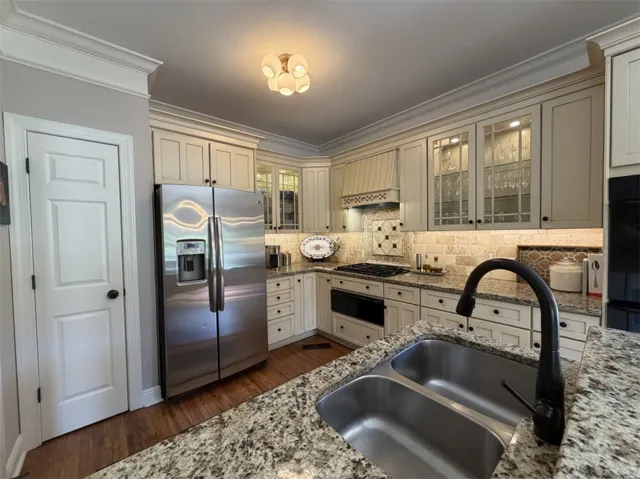 This spacious kitchen offers ample cabinet storage and a practical layout.
