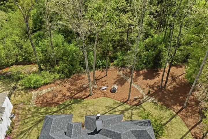 With a lovely wooded area beyond, the property enjoys privacy that is hard to come by in a neighborhood.