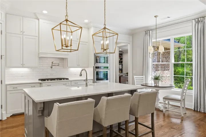 The oversized window in the breakfast area floods the kitchen with natural light.