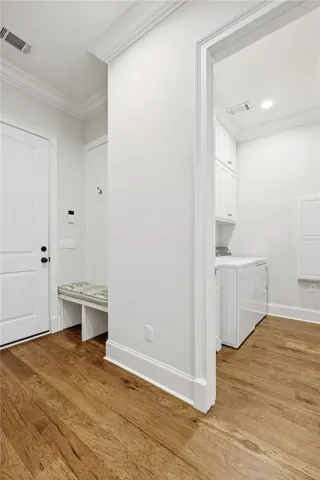 A custom bench at the owner’s entry provides a functional drop zone just off the garage.