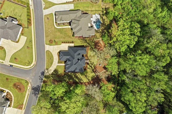 For the time being, the lot to the right of the home is vacant.