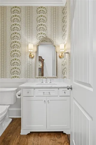 A sophisticated powder room with a bold, stylish presence.