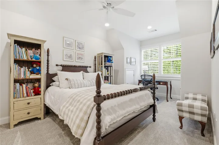 Bedroom 3 includes a charming alcove overlooking the side yard—perfect for a desk or window seat.
