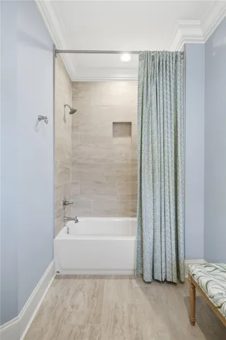 Bath 2 is generously sized, with space for a bench between the vanity and shower.