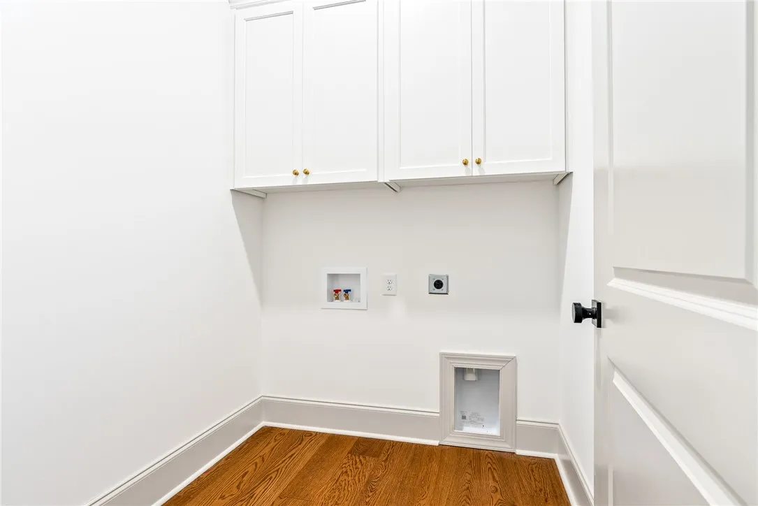 Upper cabinets in the laundry room add both sophistication and excellent storage.
