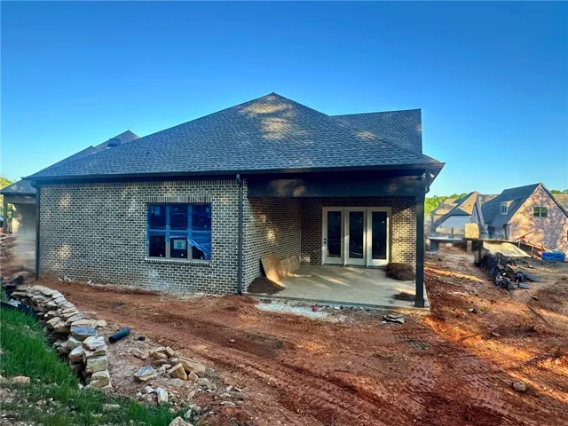 The rear porch is a great spot to enjoy the spacious and private side yard.