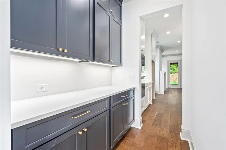 A fabulous butler's pantry wtih ceiling-height cabinetry connects the kitchen to the dining room.