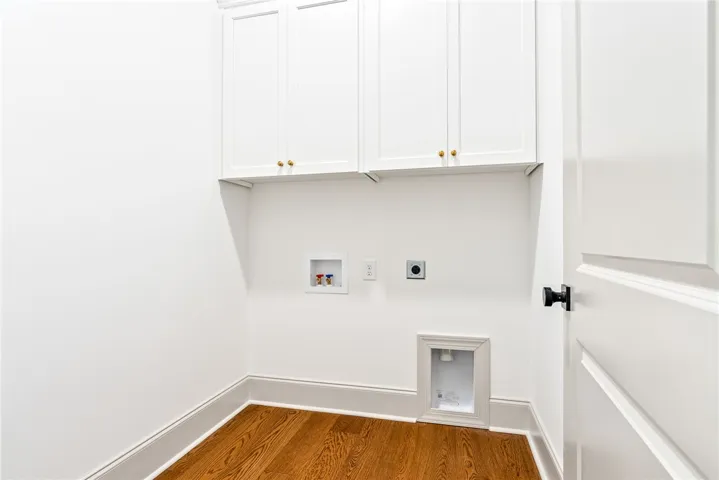 Upper cabinets in the laundry room add both sophistication and excellent storage.