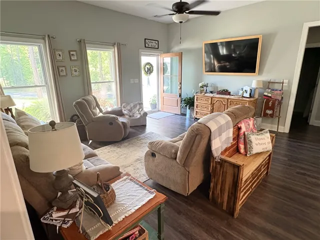 This inviting living space features high ceilings and durable flooring, ideal for comfortable daily living.
