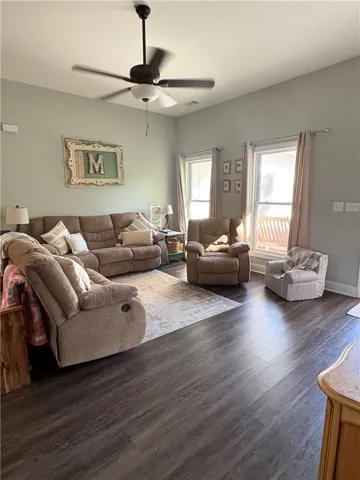 This inviting living room offers comfort and style with durable flooring and ample natural light.