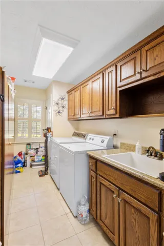 Huge laundry room with utility sink and lots of storage