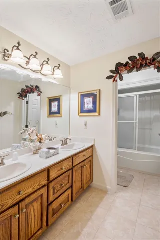 full bathroom with double vanity sinks