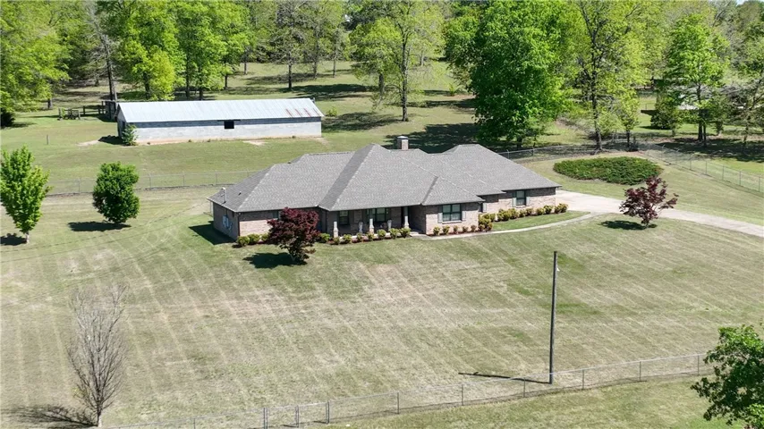 Beautiful brick home with barn, 6 acres totally fenced with cross fencing