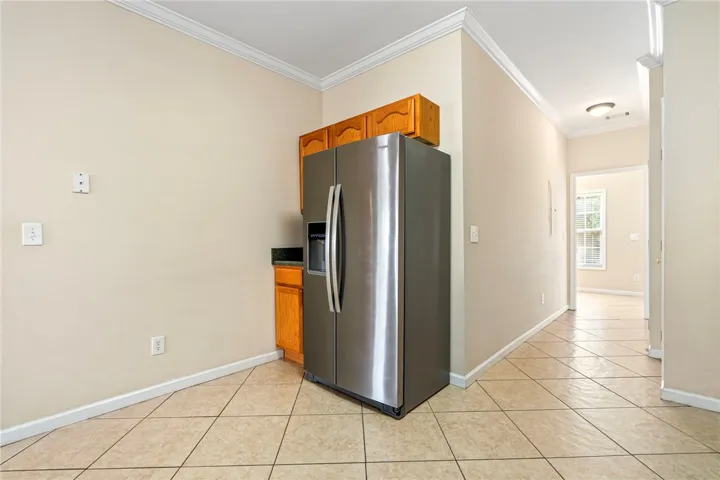 New refrigerator will remain.  Tile flooring