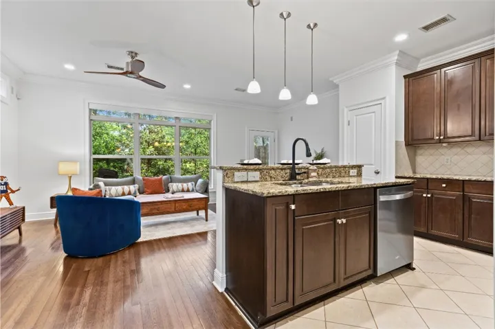 This inviting space combines a functional kitchen with a cozy living area, perfect for modern living.