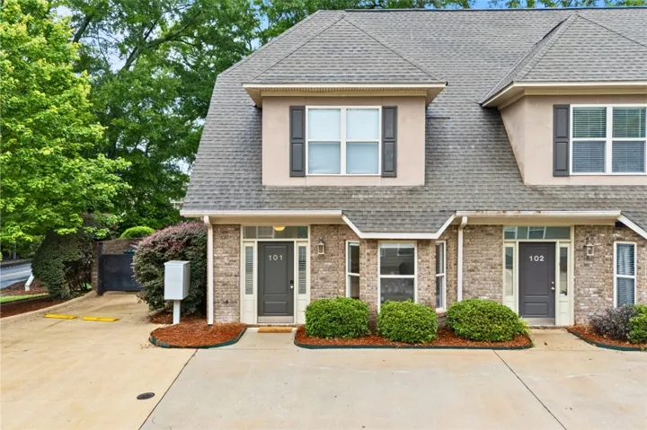 This charming condo boasts a classic brick exterior and welcoming entrance.