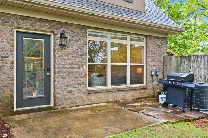 This inviting patio offers a seamless transition from indoor comfort to outdoor relaxation, perfect for gatherings.