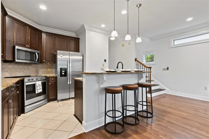This open concept kitchen features an inviting breakfast bar for added seating.