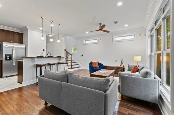 This open concept living area seamlessly connects the kitchen to the vibrant living spaces.