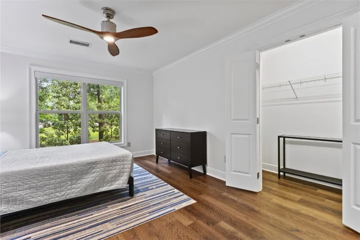 Primary bedroom has 2 large walk-in closets providing ample storage.