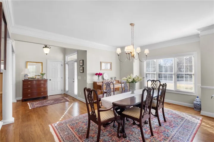 dining area offers warm hardwood flooring and ample natural light