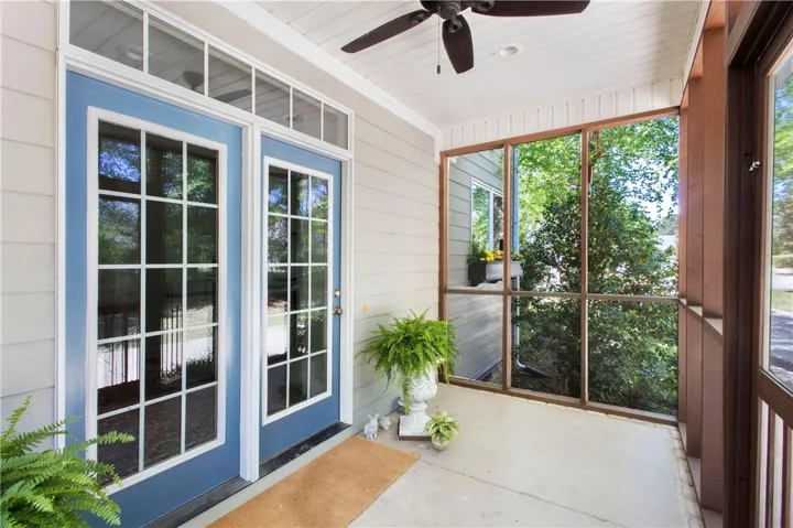 Step onto this inviting porch, perfect for enjoying peaceful moments and fresh air.