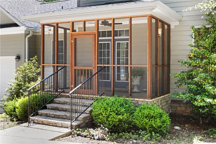 home offers a delightful screened porch, perfect for enjoying the outdoors in comfort.