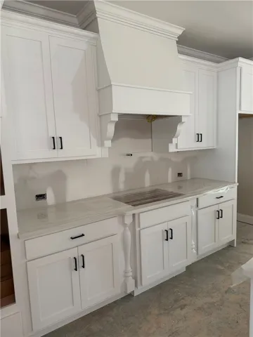 Crisp white cabinetry and sleek counters create an inviting, functional kitchen space.