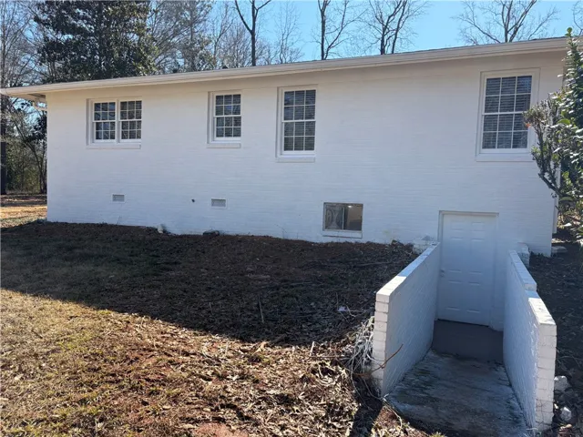 Entry to partial, unfinished basement