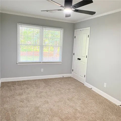 Bedroom by garage entry and backdoor