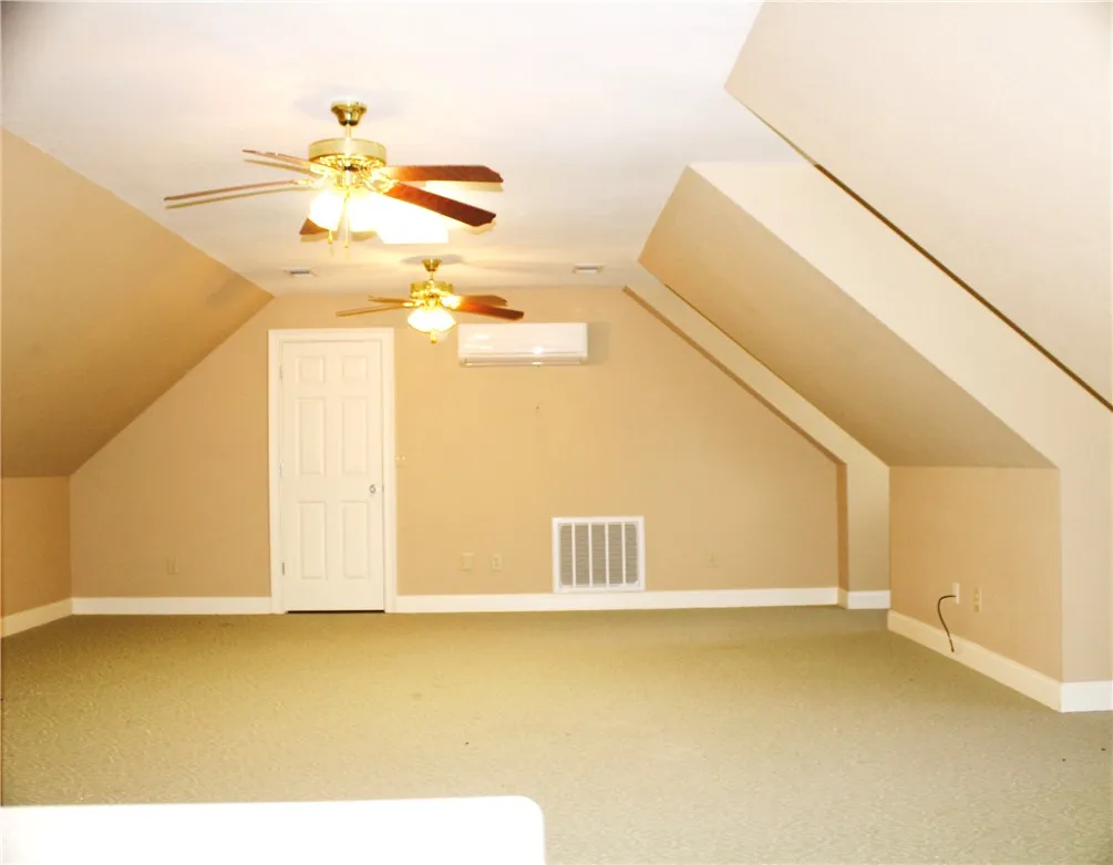 This versatile attic space offers potential for a customized living area.